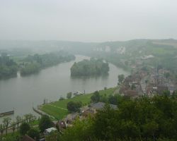 A misty view across the Seine valley; the three boats are in the middle of the picture on the green pontoon, with the harbour entrance to the left