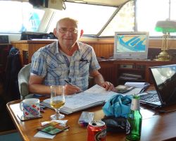 Me log-keeping and planning our 35 voyages!