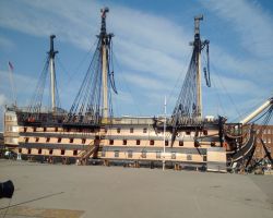 Kathleen dwarfed by the HMS Victory at the Historic Dockyard Portsmouth